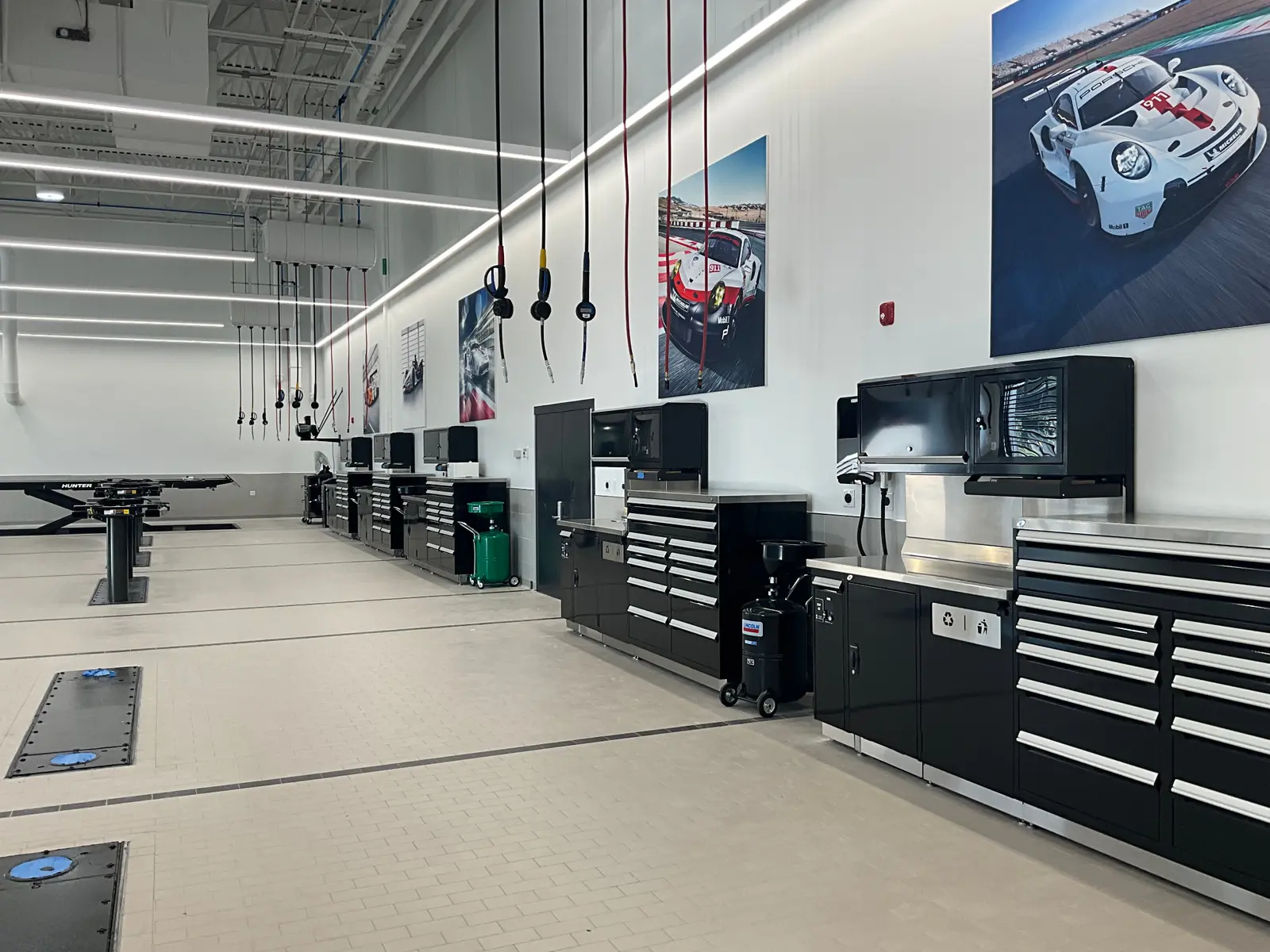 Overhead fluid and air drops above installed technician workstations