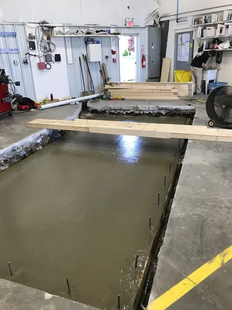 Concrete being placed for the recessed lift foundation